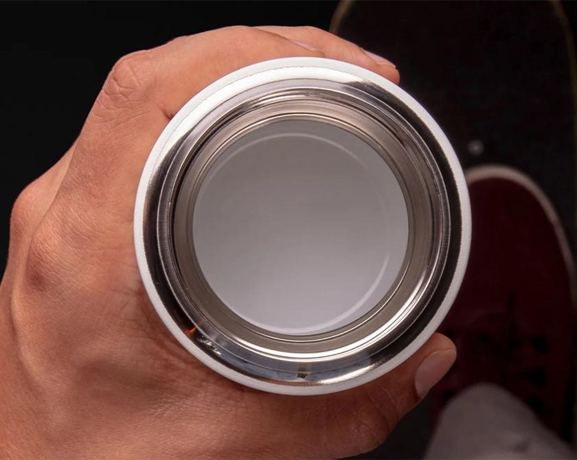Cross section of ceramic coated insulated coffee mug with stainless steel vacuum insulation