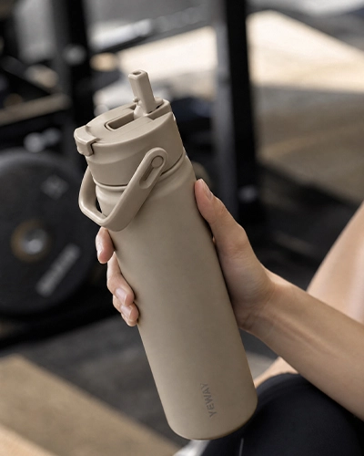 Foldable straw lid detail of premium insulated water bottle with dual drinking design