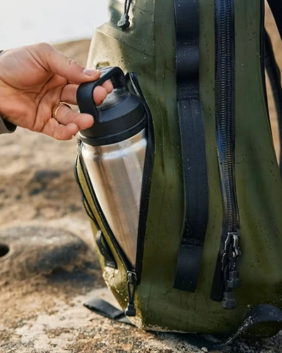 Leakproof insulated water bottle carried in backpack for outdoor travel