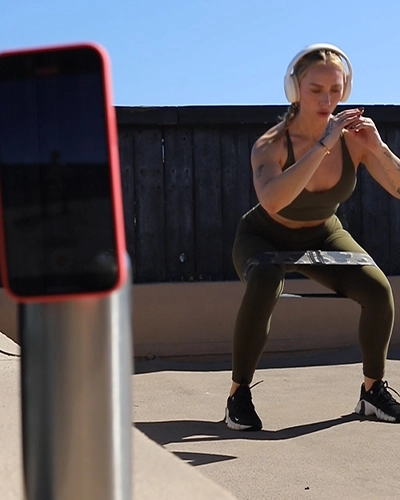 Film naturally without attention using magnetic water bottle phone mount for discreet content creation