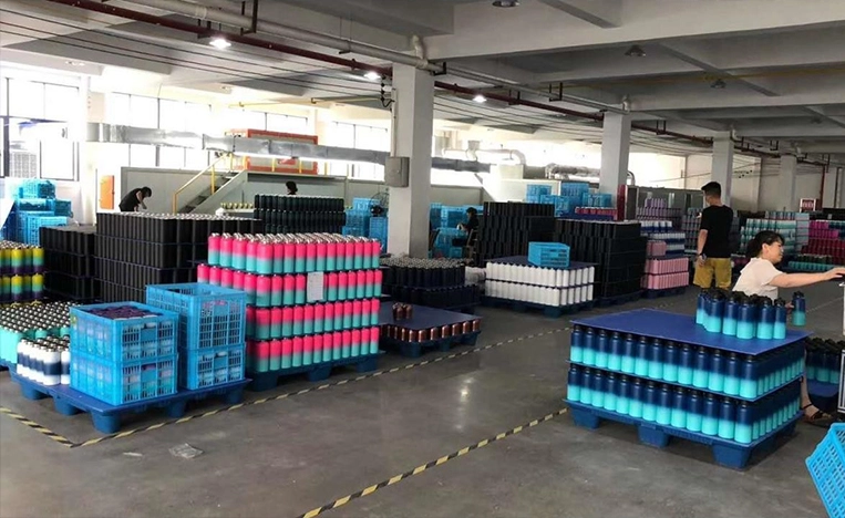 OEM insulated water bottle production line with organized stainless steel drinkware inventory