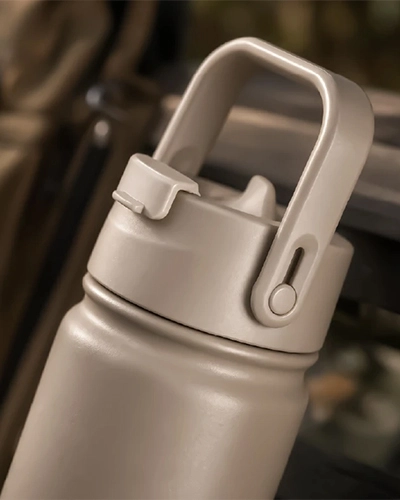 Foldable straw lid detail of premium insulated water bottle with dual drinking design