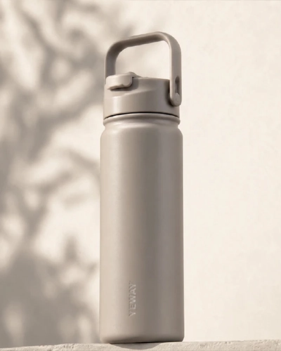 Direct sip insulated water bottle with handle used for outdoor hydration and active lifestyles
