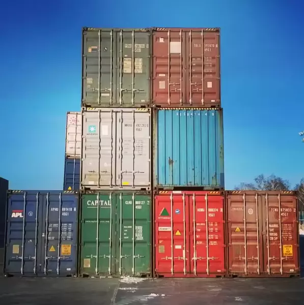 Export shipment of stainless steel tumblers and coffee mugs loaded into containers for global delivery to US and Europe