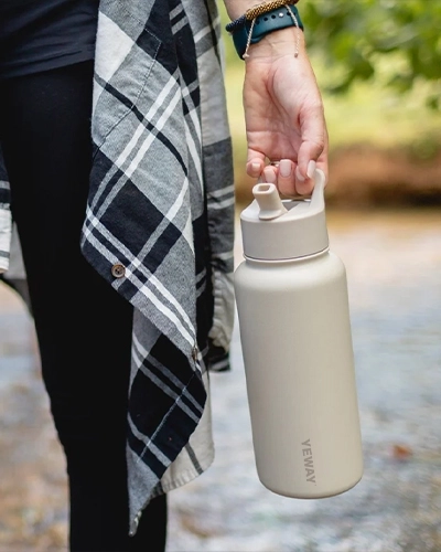 Wide mouth insulated water bottle with locking straw lid and handle