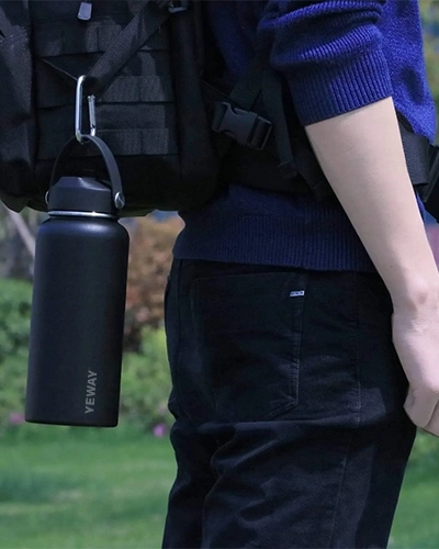 Wide mouth stainless steel water bottle with straw lid and carry handle