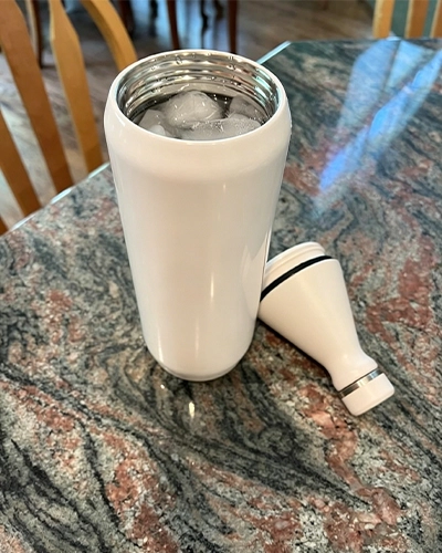 Wide mouth insulated water bottle designed for easy refilling and ice filling