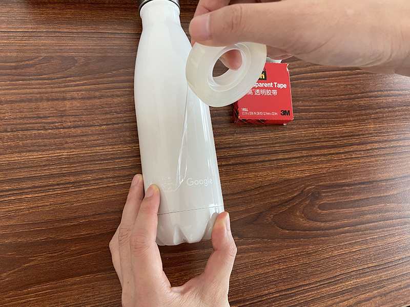 3M tape peel test for logo adhesion verification on branded promotional water bottles